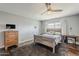 Comfortable bedroom with hardwood floors, ceiling fan and neutral walls creating a relaxing atmosphere at 402 E Claremont St, Phoenix, AZ 85012