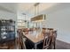 Inviting dining room with hardwood floors and a modern lighting fixture at 402 E Claremont St, Phoenix, AZ 85012