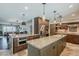 Open concept kitchen with island, granite countertops, and stainless steel appliances at 402 E Claremont St, Phoenix, AZ 85012