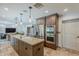 Stylish kitchen boasting stainless steel appliances, granite countertops, and generous cabinetry at 402 E Claremont St, Phoenix, AZ 85012