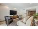 Spacious living room features a large television, comfortable seating and stylish accents at 402 E Claremont St, Phoenix, AZ 85012