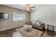 Comfortable living room features hardwood floors, a daybed, a plush rug and a large window at 402 E Claremont St, Phoenix, AZ 85012