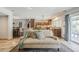 Bright living room opens to a modern kitchen with stainless steel appliances and an island at 402 E Claremont St, Phoenix, AZ 85012