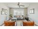Bright and cozy living room with hardwood floors, stylish furnishings, and a large window at 402 E Claremont St, Phoenix, AZ 85012