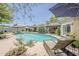 Inviting backyard pool with lounge chairs and a charming patio area perfect for relaxation at 402 E Claremont St, Phoenix, AZ 85012