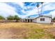 A large backyard with plenty of space for activities with a covered patio at 4062 W Mescal St, Phoenix, AZ 85029
