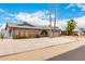 Charming single story home with brick accents, desert landscaping, and attached two car garage at 4062 W Mescal St, Phoenix, AZ 85029
