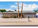 Charming single story home with brick accents, desert landscaping, and attached two car garage at 4062 W Mescal St, Phoenix, AZ 85029