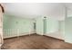 Open-concept living room with tile flooring and mirrored wall for a spacious feel at 4062 W Mescal St, Phoenix, AZ 85029