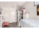Bright bedroom featuring closet with sliding doors and light-colored walls at 4142 E Sandy Way, Gilbert, AZ 85297