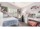 Cozy bedroom with a vanity area and window with shutters at 4142 E Sandy Way, Gilbert, AZ 85297