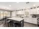 Stylish kitchen featuring white cabinets, stainless steel appliances, a central island, and modern fixtures, perfect for cooking at 4142 E Sandy Way, Gilbert, AZ 85297