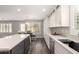 Bright kitchen with white cabinetry, a central island, stainless steel appliances, and plenty of counter space at 4142 E Sandy Way, Gilbert, AZ 85297