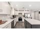 Elegant kitchen featuring white cabinetry, stainless steel appliances, a center island, and ample counter space at 4142 E Sandy Way, Gilbert, AZ 85297