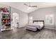 Spacious main bedroom with gray walls, wood-look floors, and a full wall built-in organizer at 4142 E Sandy Way, Gilbert, AZ 85297