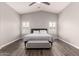 This main bedroom features wood-look floors, vaulted ceilings, and lots of natural light at 4142 E Sandy Way, Gilbert, AZ 85297
