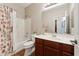 Bright bathroom with a shower-tub combination, single vanity, and decorative elements at 43884 W Kramer Ln, Maricopa, AZ 85138