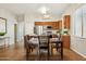 A dining area features stainless steel appliances and is next to the kitchen at 43884 W Kramer Ln, Maricopa, AZ 85138
