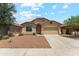 Charming single-story home featuring a well-maintained front yard and a two-car garage at 43884 W Kramer Ln, Maricopa, AZ 85138