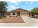 Charming single-story home featuring a well-maintained front yard and a two-car garage at 43884 W Kramer Ln, Maricopa, AZ 85138