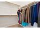 Organized walk-in closet with hanging racks and shelves, providing ample storage space at 43884 W Kramer Ln, Maricopa, AZ 85138