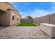 Paver stone backyard with a patch of artificial grass and mountain views at 4424 W Vervain Ave, San Tan Valley, AZ 85144