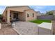 A backyard featuring a paved patio, a patch of green artificial turf, and a built-in barbeque grill at 4424 W Vervain Ave, San Tan Valley, AZ 85144