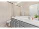 Neutral bathroom featuring a gray vanity, white countertop, and large mirror at 4424 W Vervain Ave, San Tan Valley, AZ 85144