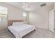 Neutral bedroom with large windows, tiled floor, and plush king bed at 4424 W Vervain Ave, San Tan Valley, AZ 85144