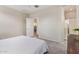 Neutral bedroom with tiled floors, and open doorway to ensuite bathroom at 4424 W Vervain Ave, San Tan Valley, AZ 85144