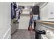 Walk-in closet with built-in shelving and ample storage space for clothing at 4424 W Vervain Ave, San Tan Valley, AZ 85144