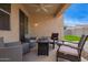 Covered patio with outdoor seating and a ceiling fan at 4424 W Vervain Ave, San Tan Valley, AZ 85144