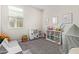 Bright playroom with carpet, a window, and play furniture at 4424 W Vervain Ave, San Tan Valley, AZ 85144