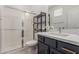 Modern bathroom with sleek vanity, stylish fixtures, and a shower with sliding glass door at 5330 W Thresher Way, Laveen, AZ 85339