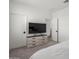 Bright bedroom with a dresser, TV, ceiling fan, and two doors for a spacious feel at 5330 W Thresher Way, Laveen, AZ 85339