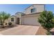 Charming two-story home with a two-car garage and desert landscaping at 5330 W Thresher Way, Laveen, AZ 85339