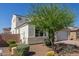 Beautifully landscaped front yard with desert landscaping and mature tree at 5330 W Thresher Way, Laveen, AZ 85339