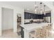 Spacious kitchen with blue cabinets, white quartz countertops, and stainless steel appliances at 5330 W Thresher Way, Laveen, AZ 85339