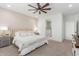 Serene main bedroom featuring a plush bed, soft lighting, and a ceiling fan at 5330 W Thresher Way, Laveen, AZ 85339