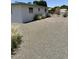 View of the backyard with fence and white home at 5342 E Des Moines St, Mesa, AZ 85205