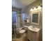 Bathroom with tub and shower combo, vanity with sink and mirror, and neutral color scheme at 5342 E Des Moines St, Mesa, AZ 85205