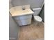 Bathroom features white sink, tile floors, toilet and gray walls at 5342 E Des Moines St, Mesa, AZ 85205