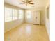 Bright bedroom featuring tile flooring and multiple windows, creating a serene and inviting space for rest and relaxation at 5342 E Des Moines St, Mesa, AZ 85205