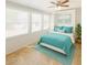 Bedroom with three big windows, large bed, and stylish teal accents at 5342 E Des Moines St, Mesa, AZ 85205