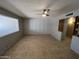 Bright living room with tile flooring and ample space, perfect for relaxing and entertaining with neutral decor at 5342 E Des Moines St, Mesa, AZ 85205