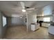 Spacious living room with tile flooring and a view into the kitchen provides a bright and welcoming atmosphere at 5342 E Des Moines St, Mesa, AZ 85205