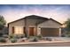 Charming single-story home with desert landscaping and a two-car garage offering curb appeal at 6383 W Rushmore Way, Florence, AZ 85132