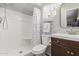 Compact bathroom with a stand-up shower, modern vanity, and neutral color scheme at 701 N 55Th Pl, Mesa, AZ 85205