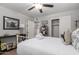 Cozy bedroom featuring a ceiling fan, closet, and stylish furnishings at 701 N 55Th Pl, Mesa, AZ 85205
