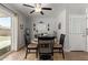 Charming dining area with a modern ceiling fan, a round table, and stylish decor at 701 N 55Th Pl, Mesa, AZ 85205
